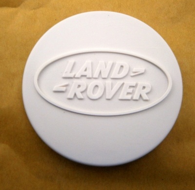 Image of ANR3861, a 'STEEL WHEEL CENTRE CAP WHITE DEFENDER' part
